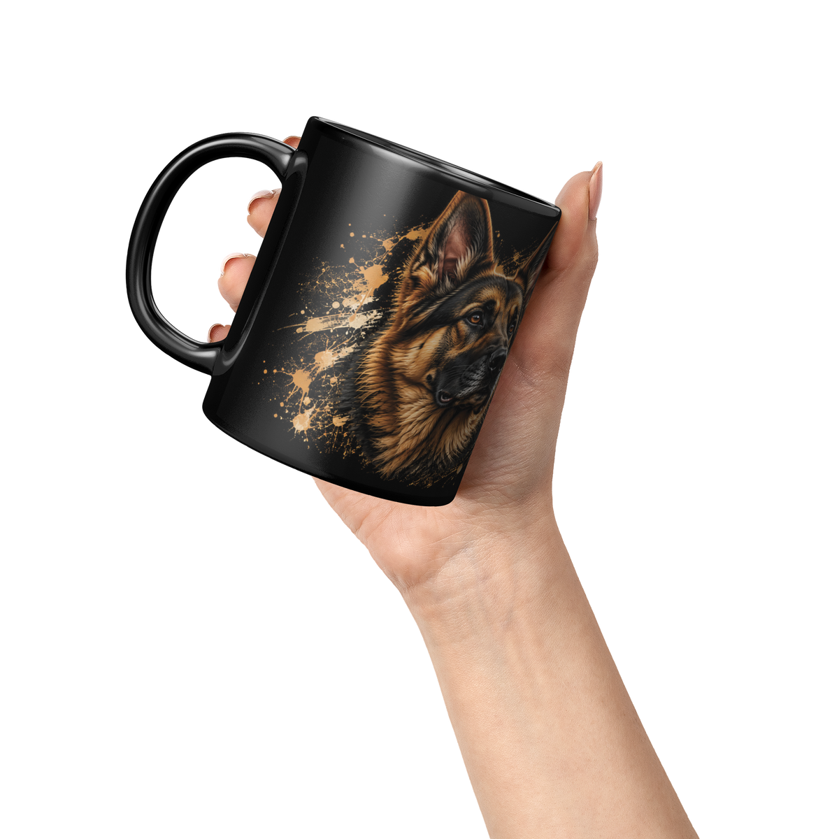 Hand holding a black coffee mug with a German Shepherd portrait and gold paint-splash design.